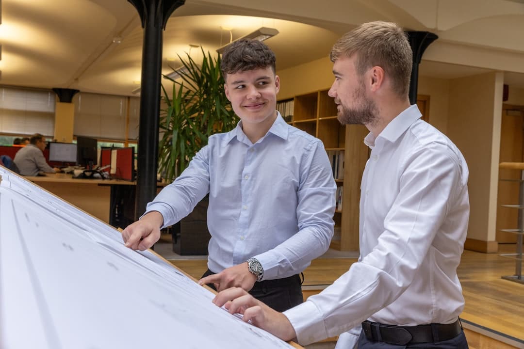 architect and investor discussing construction plans