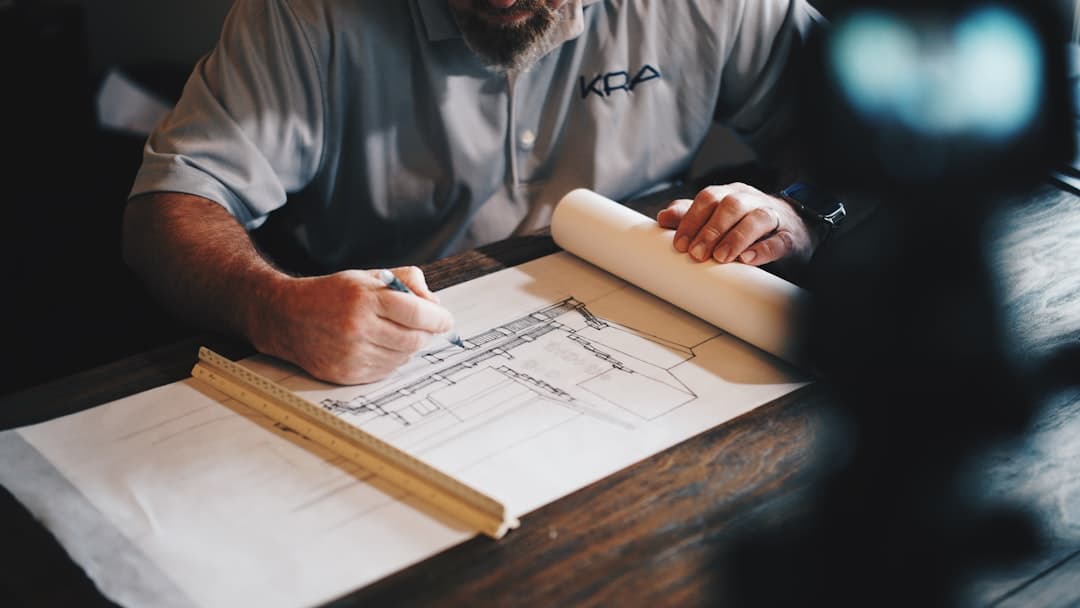 architect reviewing blueprints